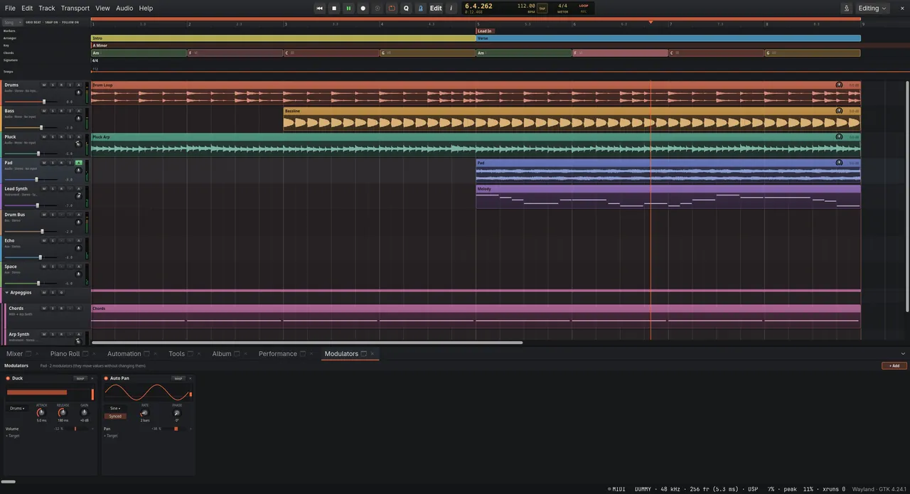 The Editing workspace: markers, sections, key and chord lanes above the tracks, arpeggios in a folder, and two modulators in the bottom dock.